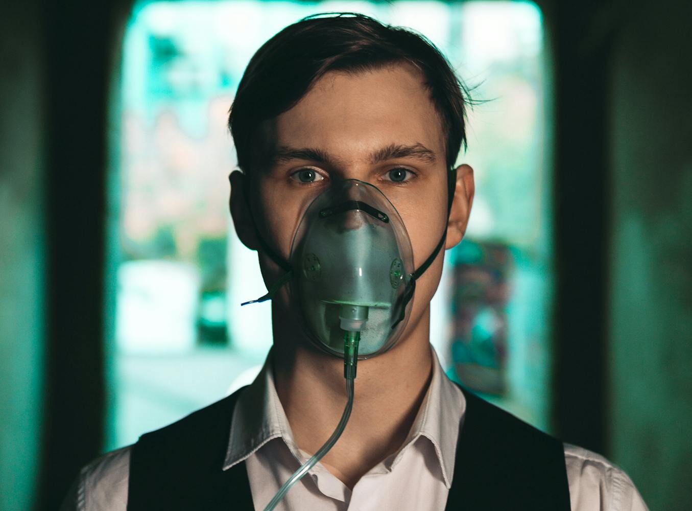 Man in Shirt with Vest and in Oxygen Mask